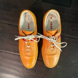 PRADA Orange Leather Sneakers with Red Accent and White Laces
